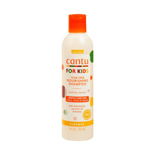  "Imagen del Champú Cantu Kids, fórmula sin lágrimas para niños, con ingredientes como manteca de karité, aceite de coco y miel, diseñado para rizos y ondas."